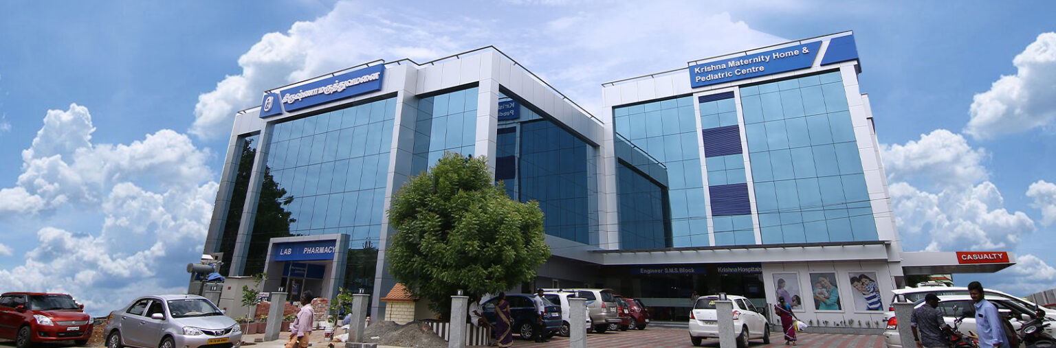 Mother holding her newborn baby at Krishna Hospital, Tirunelveli